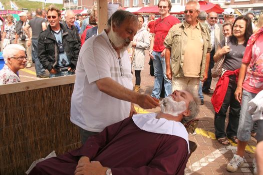 Old fashioned barber at a festival