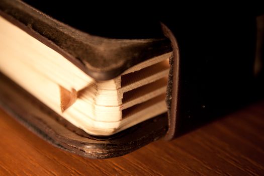 old vintage calendar or organizer lying on wooden table