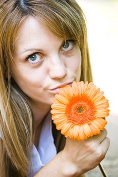 beautiful young blonde woman with flower