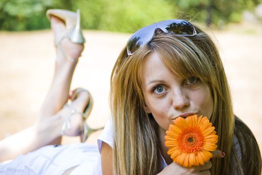 beautiful young blonde woman with flower