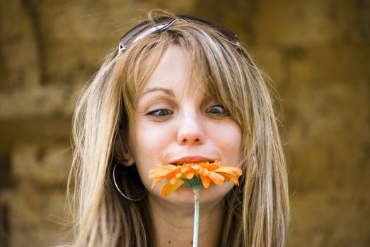 beautiful young blonde woman with flower