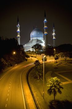 Night image of Sultan Salahuddin Abdul Aziz Shah Mosque or commonly known as the Blue Mosque, located at Shah Alam, Selangor, Malaysia. 