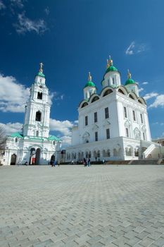 Picture is very beautiful building, on a background of sky and clouds