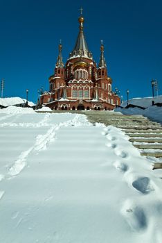 Picture is very beautiful building, on a background of sky and clouds