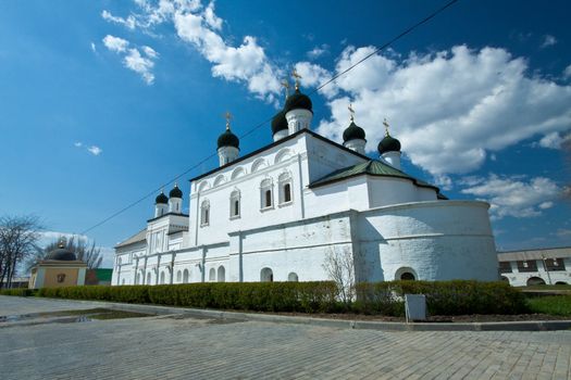 Picture is very beautiful building, on a background of sky and clouds