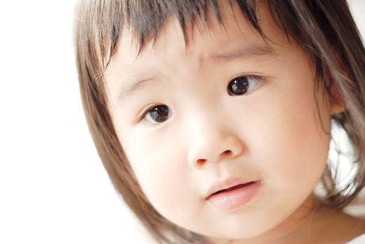 She is a beautiful Asian baby with innocent face.