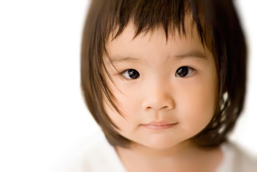 She is a beautiful Asian baby with innocent face.