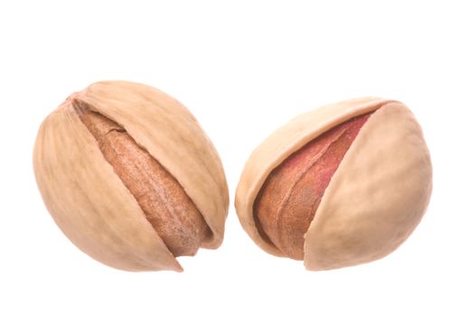 Isolated macro image of natural (non bleached) Pistachio nuts.