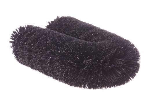 Isolated image of a black laundry washing brush.