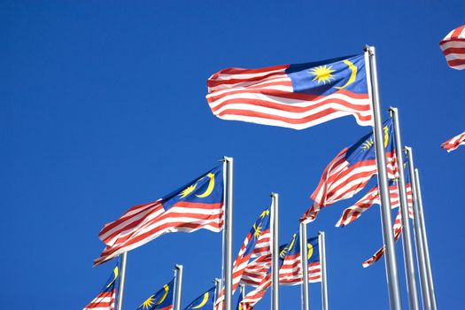 Image of Malaysian flags, also known as Jalur Gemilang, flying high.