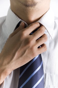Concept photo of a businessman doing his tie 