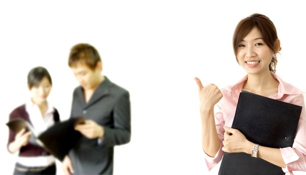 smiling business woman holding a file with her team members 
