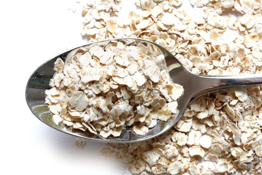 Oats in a heap isolated on white