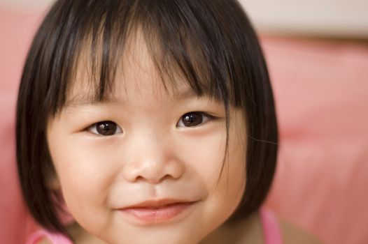 little asian girl with smiling face

