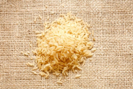Parboiled rice on a texture background