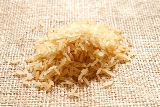 Parboiled rice on a texture background