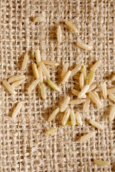 Brown rice on a textile background