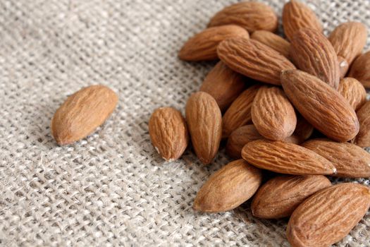 Heap of almonds on a textile bag