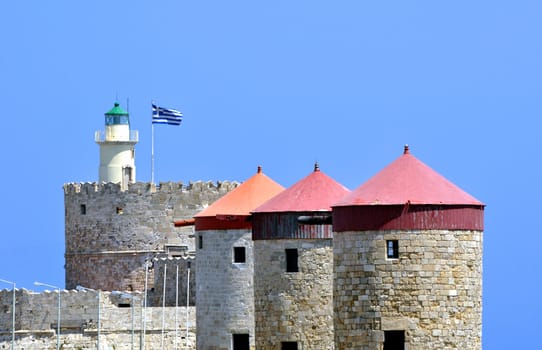 Travel Europe: Lighthouse, mills and Fortress of Saint Nicholas, Rhodes, Greece.