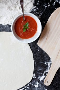 Pizza ingredients on a counter top