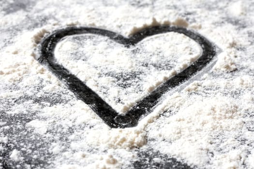 A love shape in white flour