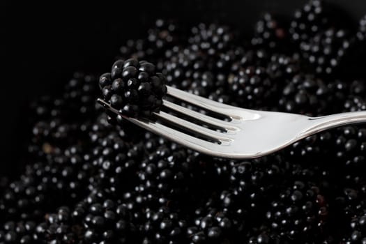 Blackberries on a fork ready to eat