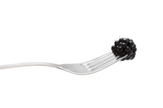 Blackberries on a fork ready to eat