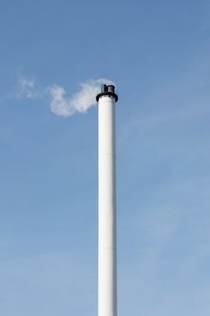 A factory with a tall chimney