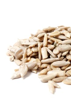 Healthy sun-flower seeds on a white background