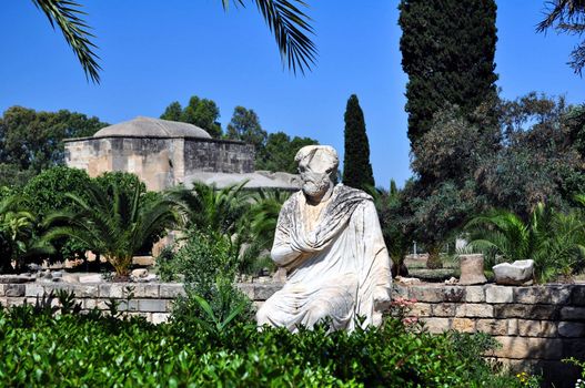 Travel photography: marble roman statue and the Ayios Titos Basilica at Gortyn