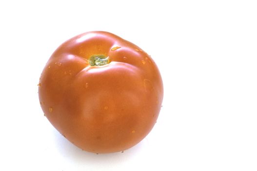 The fresh ripe tomato wishes to get more likely by a dinner on a table