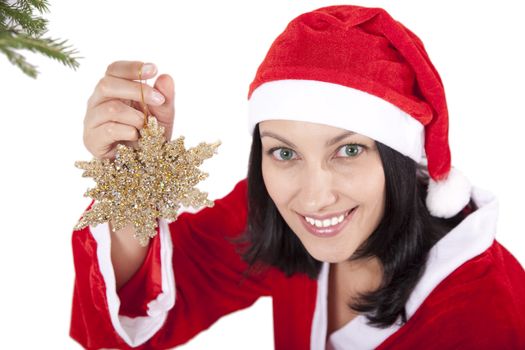 Smiling girl in christmas cap with toy in hand over white