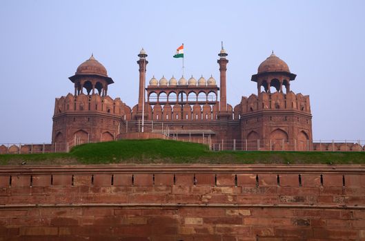 Antique indian red fort in Delhi with flag