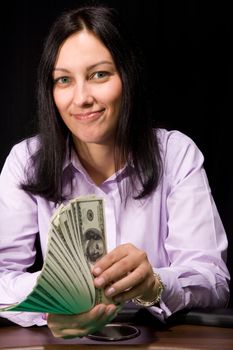 Pretty caucasian girl holds cash in hands in casino