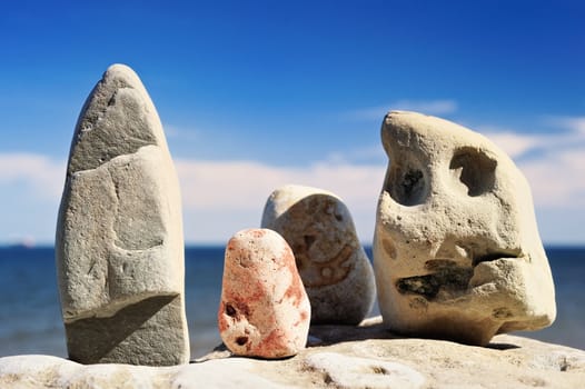 A group of four stones of various shapes