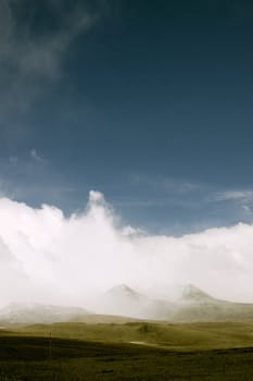 Landscape with mountains and storm clouds

