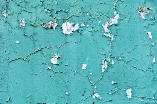 Blue wall with cracks - an architectural background in retro style