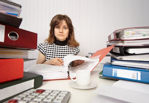 Female accountant very busy working in the office