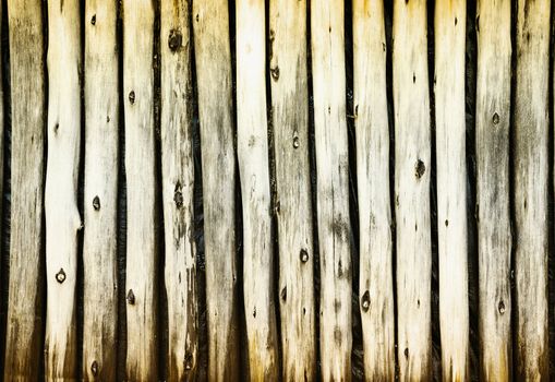 Dilapidated old wooden fence - a rural grunge background