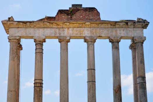 Ancient classical Portico against a blue sky. Rome, Italy