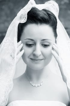 Portrait of the beautiful bride in a veil