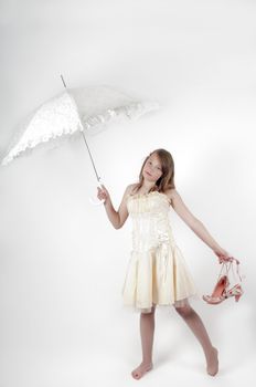 Youth girl with white umbrella in studio