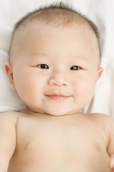 Happy 6 months old Asian baby boy