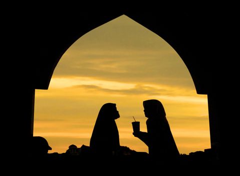 Islamic woman infront a mosque 
