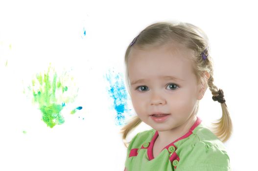 A little girl standing in studio