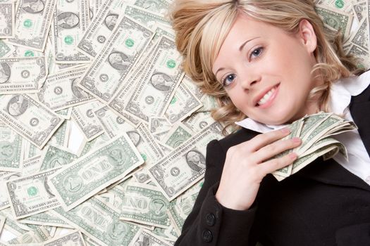 Business woman laying in money