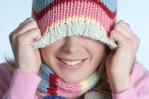 Playful winter beanie hat girl