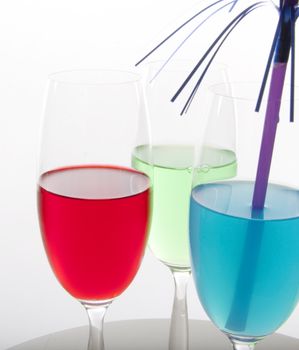 Colorful cocktails in red, green and blue with festive decoration