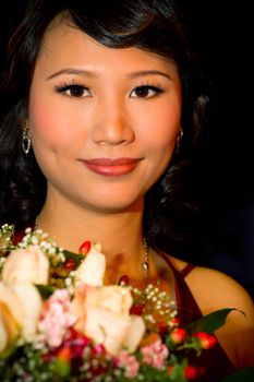 Asian bride with flower bouquet