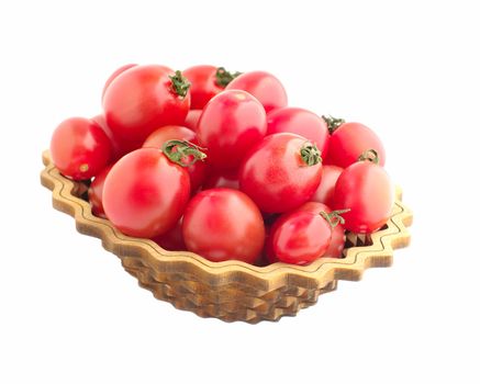 red small tomatos in dish on white isolated